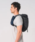 Side view of person wearing Lightweight Hydration Backpack For Runners With 12L Capacity, Breathable Mesh Back Panel, Two 500ml Soft Flasks