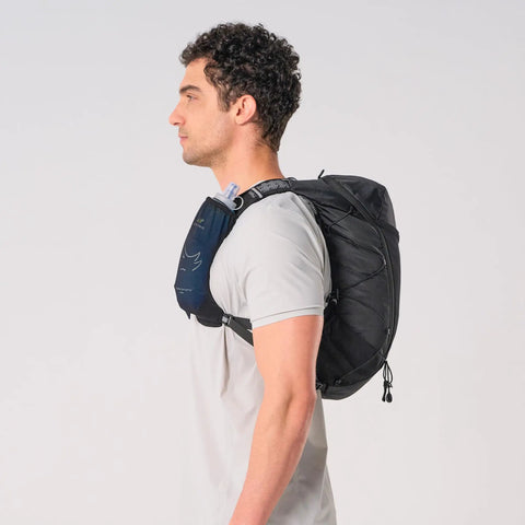 Side view of person wearing Lightweight Hydration Backpack For Runners With 12L Capacity, Breathable Mesh Back Panel, Two 500ml Soft Flasks