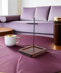 Top Shelf Wood Coffee Dripper Stand Built Tough With Stainless Base on a table next to a coffee mug and thermos.