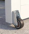 Low Profile Side Mount Caster Wheels Kit, 2 Brown Rolling Casters With 4 Screws attached to white wood for sliding gates