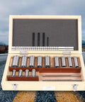 Open wooden box displaying Keyway Broach Kit 22 Pc Set with 4 broaches, 5 shims, and 13 bushings, high-speed steel tools for metalworking.