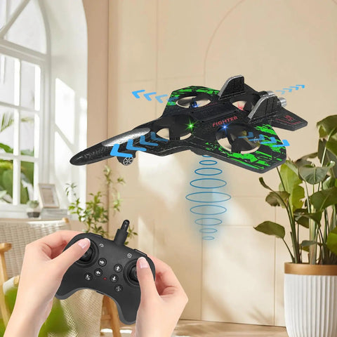 Person using remote to fly a kids and beginners friendly remote control airplane with 2.4GHz radio and LED lights in green indoors.
