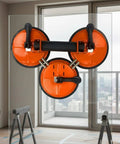 Super Heavy Duty Glass Suction Lifter With Rubber Grip And Nylon Parts For Moving Tiles Panels Safely Up To 440 Pounds During Construction Jobs Easy Hand Control Material Handling mounted on glass with vibrant orange suction cups.
