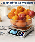 Beefy 110 Pound Food Scale With Price Computing in kitchen setting weighing fruits, 304 stainless steel, 1 gram increments.