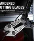 Close-up of Beefy 30 Inch Bolt Cutter With Bi Material Handle And Soft Rubber Grip cutting metal, highlighting chrome molybdenum blades.