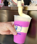 Close-up of creamy milkshake being dispensed from a Commercial Dual Tank Ice Slush Machine For Top Shelf Margaritas And Creamy Milkshakes With Smart Freeze Tech And Heavy Duty Build To Keep Your Setup Runnin Smooth And Frosty All Weekend Long.