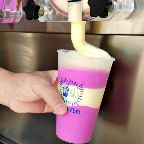 Close-up of creamy milkshake being dispensed from a Commercial Dual Tank Ice Slush Machine For Top Shelf Margaritas And Creamy Milkshakes With Smart Freeze Tech And Heavy Duty Build To Keep Your Setup Runnin Smooth And Frosty All Weekend Long.