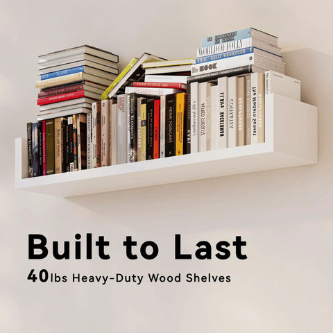 Fresh White Floating Wall Shelves Set Of Four U Shaped Wall Mounted Bookshelf holding various books on a solid white shelf.