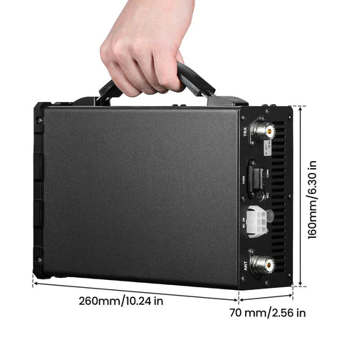 Person holding XPA125B 100W Power Amplifier With Auto Antenna Tuner And Large Display Screen, showing size dimensions.