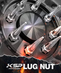 Close-up of Spike Lug Nuts Set M14x1.5 Chrome 32 Piece For 60 Degree Cone Seats 19mm Hex Closed End on wheel, silver spikes at center.