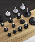 Assorted Adjustable Threaded Chair Feet Floor Protectors 50 Pack With Silent Damping No Slip Base Pads displayed on wood surface