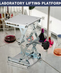 Front view of stainless steel lab lift table with scissor jack, 6x6 in top, adjustable 75–260 mm, black hand wheel