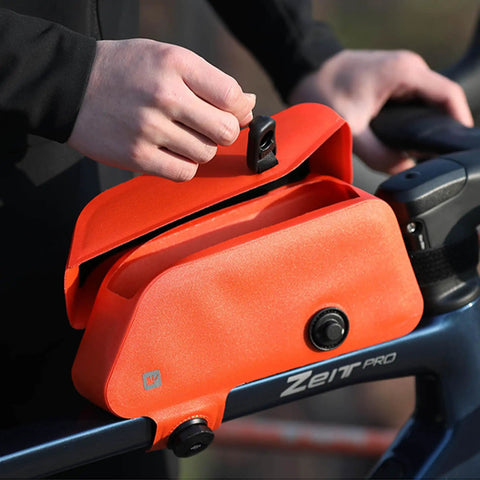 Cyclist using Waterproof Bike Frame Bag With Magnetic Flap And One Hand Access Top Tube Storage For MTB And Road Bikes Durable Welded TPU