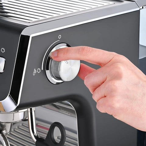 User adjusting the control knob on a Fully Automatic Espresso Machine With Badass Burr Grinder And Hella Smooth Pulls.