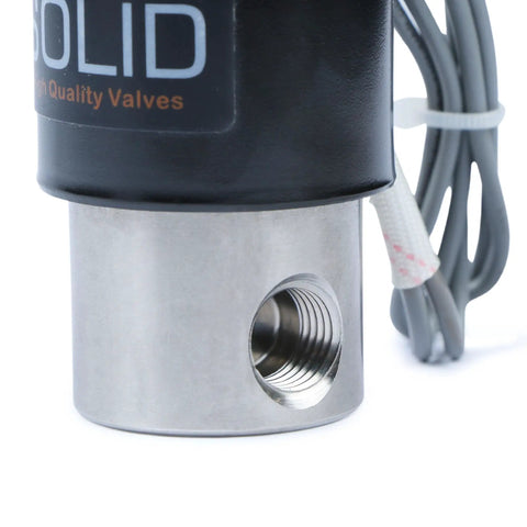 Close-up of stainless steel 1/4 inch electric solenoid valve 24VDC normally closed with Viton seals, showing industrial grade port.