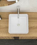 White Ceramic Square Vessel Bathroom Sink with sleek design and chrome faucet on wooden countertop.