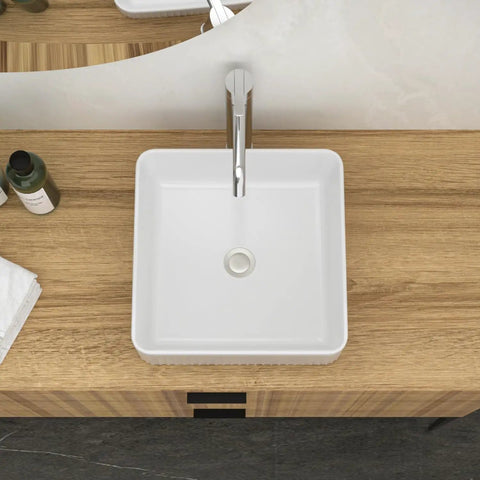 White Ceramic Square Vessel Bathroom Sink with sleek design and chrome faucet on wooden countertop.