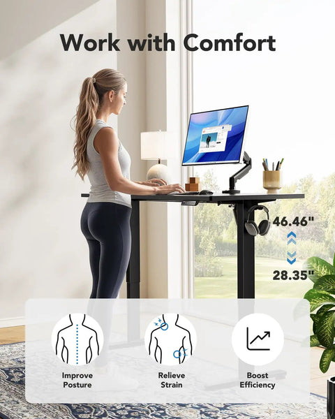 Woman using Electric Standing Desk With Real Deal One Piece Desktop Adjustable Height For Sit Stand Four Memory Settings