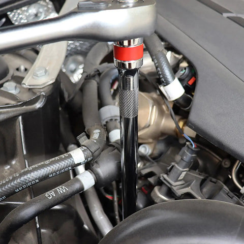 Versatile 9 Piece Ball Joint Socket Adapter Kit For Mechanics And DIYers With High Strength Steel Extensions To Tackle Tight Engine Slots and Confined Spaces Smoothly. Socket adapter in engine bay tightening a fastener near hoses