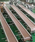 Rock Solid One Meter Flat Top Conveyor Chain With 38.1mm Pitch And 152.4mm Width Single Hinge Direct Drive Transmission for beverage lines, showing conveyor sections.