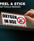 Heavy Duty Oxygen In Use Warning Signs, Straight Up No Smoking Open Flames Alert, Top Tier Waterproof Vinyl Stickers being applied.