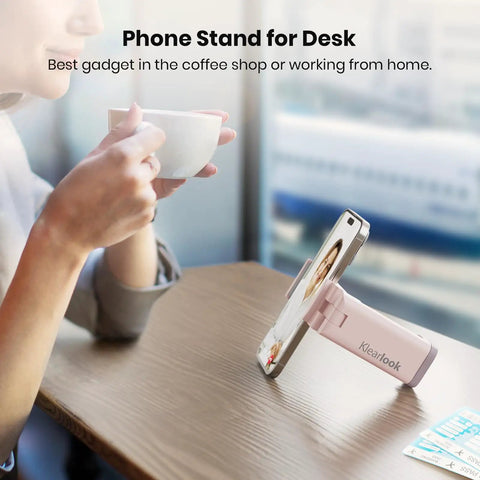Airplane Phone Holder Mount for Travel Must Haves, light pink phone stand on a table, hands-free device angle demonstration.