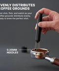 Subminimal Flick WDT espresso distribution tool, side view, black handle with 0.35mm needles over a portafilter.