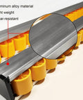 Close-up of aluminum alloy frame and orange skate wheels on Heavy Duty Conveyor With Plastic Skate Wheels For Flow Rack Conveyor Use