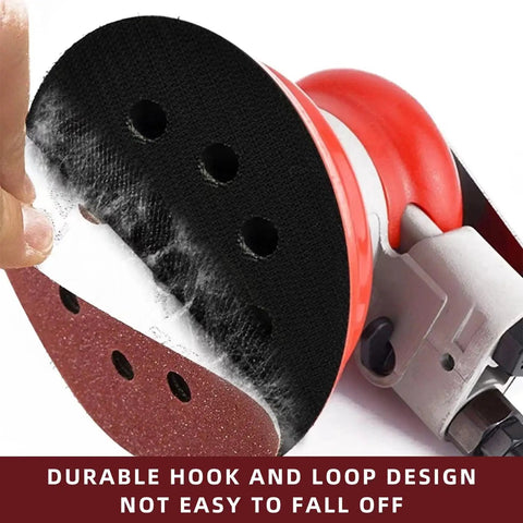 Close-up of 5 inch 8 hole sanding disc with hook and loop attachment on an orbital sander for efficient dust extraction.