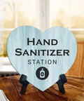 Heart Shape Hand Sanitizer Station Sign With Sturdy Black Easel Stand 6X5 Inch Wood Finish Tabletop Counter Decor For Beauty Salon Retail Shop Or Home Office Keep Your Setup Fresh And Looking Dope Day One, displayed on a wooden table.