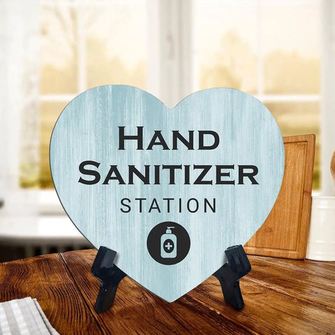 Heart Shape Hand Sanitizer Station Sign With Sturdy Black Easel Stand 6X5 Inch Wood Finish Tabletop Counter Decor For Beauty Salon Retail Shop Or Home Office Keep Your Setup Fresh And Looking Dope Day One, displayed on a wooden table.