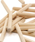 Heavy Duty Wooden Dowel Pins Six By Fifty Millimeter Straight Shot Replacement For Flat Pack Furniture And Wobbly Shelves Solid Core Joint Reinforcement Makes Quick Repairs A Total Breeze. Beige hardwood dowel pins scattered on a white background.