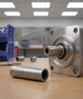 Heavy Duty Steel Car Lift Machine Pump Coupler Shaft With Vibration Reduction And Efficient Torque Transfer Silver on workshop table