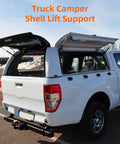 Set Of 2 16 Inch Gas Shock Strut Lift Support For LEER ARE Snugtop Truck Camper Shell Window Topper Canopy Door Cap Replacement Parts 38lb 169N Lift Fits 15 7 Inch Depth supporting a truck canopy.