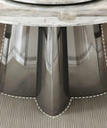 Detailed view of the solid black metal pedestal base of Top Shelf Faux Marble Round Dining Table With Effortless Spin Lazy Susan Turntable.