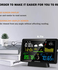 All-In-One Weather Station With No-Fuss Self-Emptying Wireless Rain Gauge For Indoor Outdoor Use, on table with books and glasses