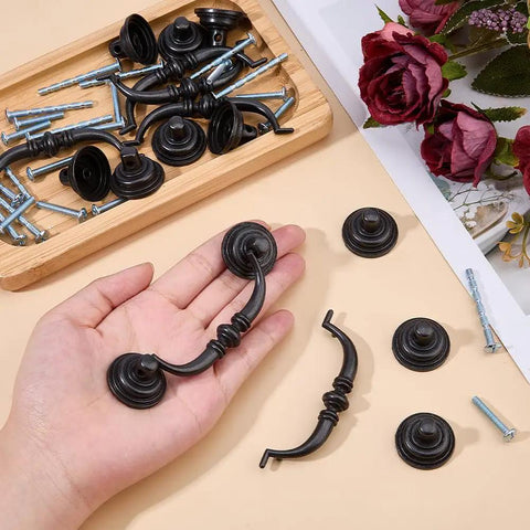 Hand holding Antique Drop Bail Pulls Set of 6 Cabinet Handles with 12 Screws Zinc Alloy Drawer Pulls for Dressers Cupboards Kitchen