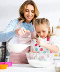 Woman and child using Stainless Steel Hand Push Rotary Whisk Blender Semi Automatic Kitchen Tool For Beating Eggs, Whipping Milk, Frothing Cream And Stirring
