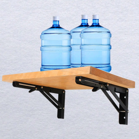 Legit Heavy Duty Black Folding Shelf Brackets Wall Mount Supports Rock Solid 150 Lb Load Capacity Pack Of Two holding wooden shelf with water bottles.