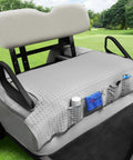 Cooling Butter Soft Ice Silk Golf Cart Seat Cover With Four Pockets Universal Fit For EZGO Yamaha Club Car on gray bench.