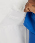 Relaxed Fit Five Pocket Three Button Full Length White Medical Lab Coat For Women detailed pocket view with hand reaching inside.