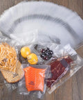Heavy Duty 8x12 Inch Vacuum Sealer Bags 200 Count PreCut Quart With Cutter Box BPA Free Puncture Resistant with food items inside