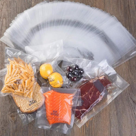 Heavy Duty 8x12 Inch Vacuum Sealer Bags 200 Count PreCut Quart With Cutter Box BPA Free Puncture Resistant with food items inside