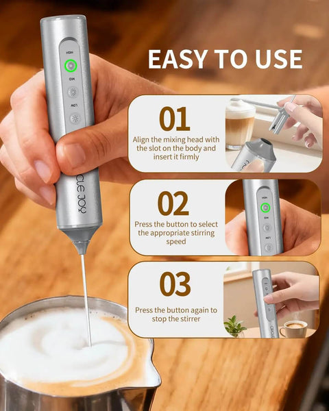 Top Drawer Rechargeable Handheld Milk Frother Wand With Three Adjustable Speed Levels And Solid Stainless Whisks For Silky Latte Foam And Quicker Batter Mixing Comes With Nifty Storage Case In Sleek Silver in use, demonstrating easy operation.