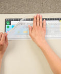 Applying EZ-Fit Desktop Helper Tape Strips Pack of 36 Student Desk Name Tags for organization on classroom desk