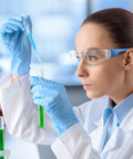 Scientist wearing 48 Pack Safety Glasses With Clear Lenses For Work And Lab Eye Protection Goggles, Lightweight One Size Fits Most, Blue Frame
