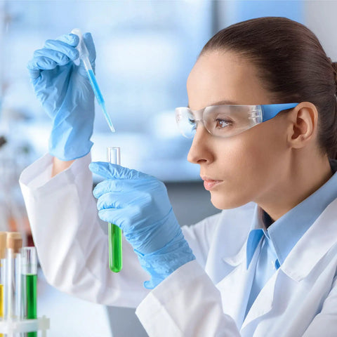 Scientist wearing 48 Pack Safety Glasses With Clear Lenses For Work And Lab Eye Protection Goggles, Lightweight One Size Fits Most, Blue Frame
