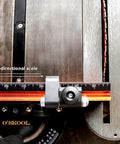 Close-up of Next Level Miter Gauge with 22-to-36-Inch Extension Fence showing bi-directional scale for accurate measurements.