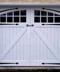 Badass Heavy Duty Two Inch Swivel Eye Latch Set Of 8 Secures Exterior Garden Gates Wood Doors And Fences With Rust Proof Black Mounts Fastened Tight For Tough All Season Use on a white garage door.