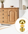 Hella Durable Gold Brass Decorative Screws With Rust Resistant Caps For Super Easy Furniture Upholstery and Mirror Mounting, shown on wooden cabinet.